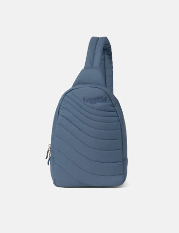 A blue quilted sling bag with a single shoulder strap and a front zipper pocket, displayed against a plain white background.
